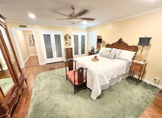 1516 N Hudson St, Altus, OK 73521 - bedroom featuring french doors, wood finished floors, crown molding, ceiling fan, and recessed lighting