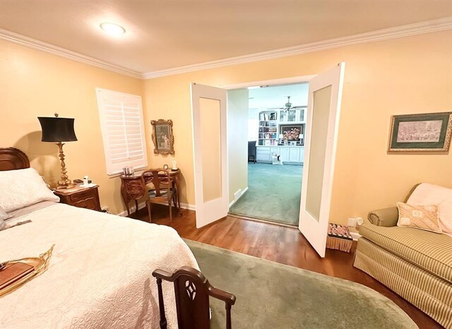 1516 N Hudson St, Altus, OK 73521 - bedroom with ornamental molding and wood finished floors