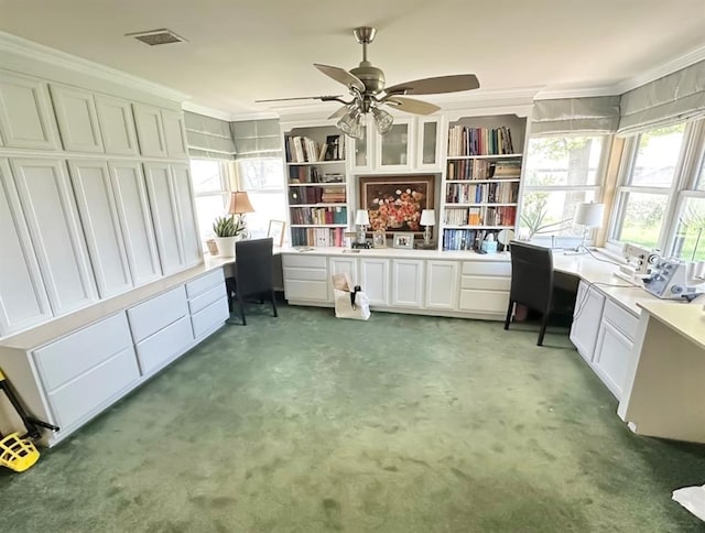 1516 N Hudson St, Altus, OK 73521 - office with light carpet, built in desk, ornamental molding, and ceiling fan