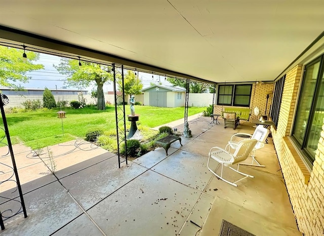 1516 N Hudson St, Altus, OK 73521 - view of patio with a shed