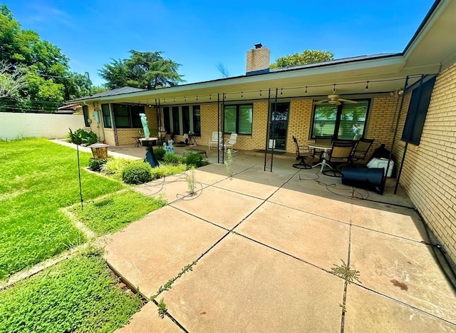 1516 N Hudson St, Altus, OK 73521 - back of property with brick siding, a chimney, and a patio area