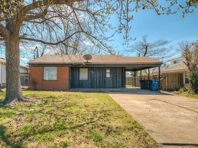2104 Westchester Dr, Oklahoma City, OK 73120 - single story home featuring board and batten siding, driveway, a carport, and brick siding