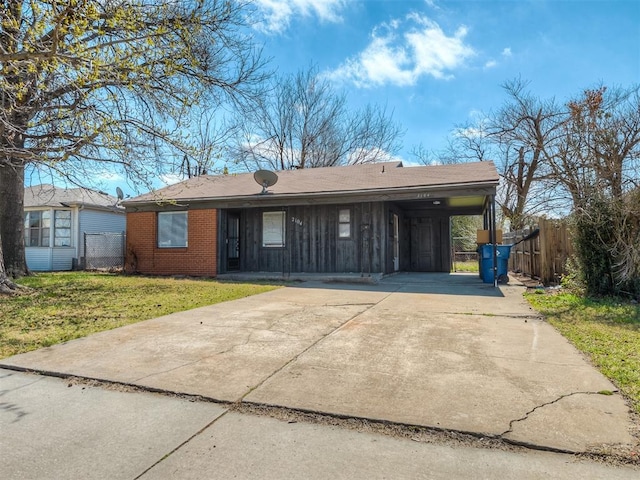 2104 Westchester Dr, Oklahoma City, OK 73120 - view of front of property featuring driveway, a carport, and brick siding