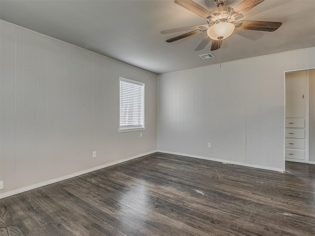 2104 Westchester Dr, Oklahoma City, OK 73120 - spare room with dark wood-type flooring and ceiling fan