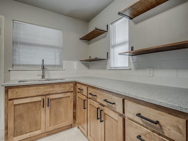 2104 Westchester Dr, Oklahoma City, OK 73120 - kitchen featuring open shelves, tasteful backsplash, and light stone counters