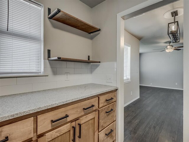 2104 Westchester Dr, Oklahoma City, OK 73120 - kitchen featuring open shelves, tasteful backsplash, dark wood-type flooring, ceiling fan, and healthy amount of natural light
