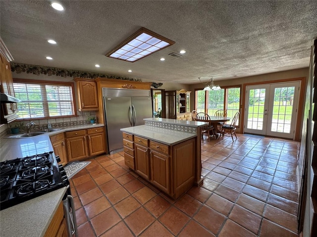 36166 Ew 1120th Rd, Seminole, OK 74868 - kitchen featuring built in fridge, recessed lighting, a textured ceiling, light countertops, and black gas range oven