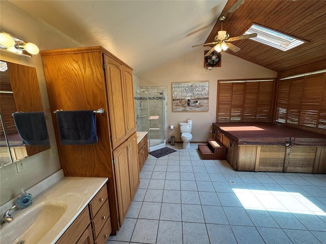 36166 Ew 1120th Rd, Seminole, OK 74868 - full bath with a skylight, a ceiling fan, tile patterned flooring, vaulted ceiling, and a shower stall
