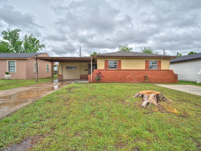 2805 SW 60th St, Oklahoma City, OK 73159 - single story home with driveway, an attached carport, a front yard, and brick siding