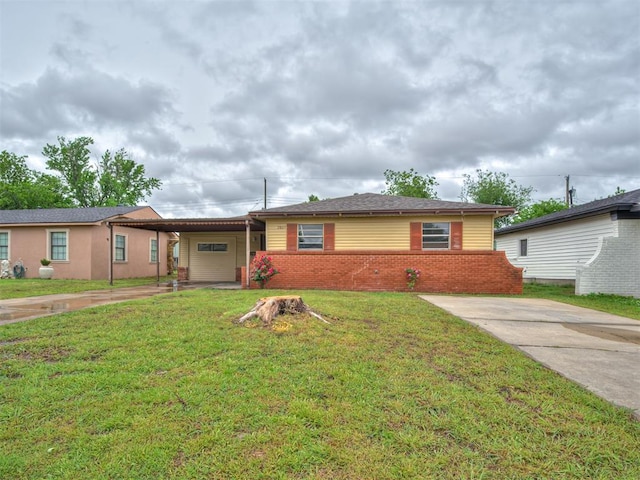 2805 SW 60th St, Oklahoma City, OK 73159 - single story home featuring concrete driveway, a front lawn, an attached carport, and brick siding