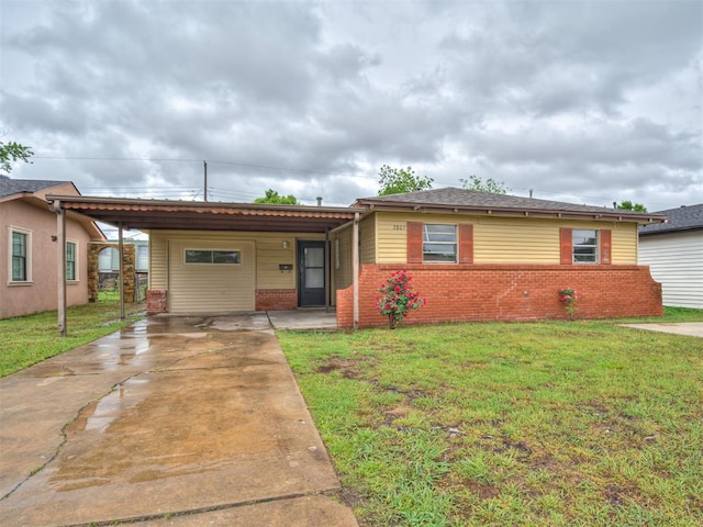 2805 SW 60th St, Oklahoma City, OK 73159 - bungalow featuring brick siding, a front lawn, a carport, and driveway