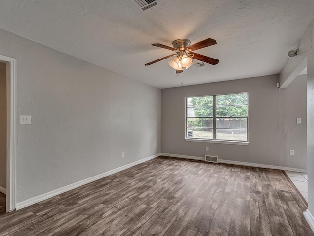 2805 SW 60th St, Oklahoma City, OK 73159 - empty room featuring wood finished floors, ceiling fan, and a textured ceiling