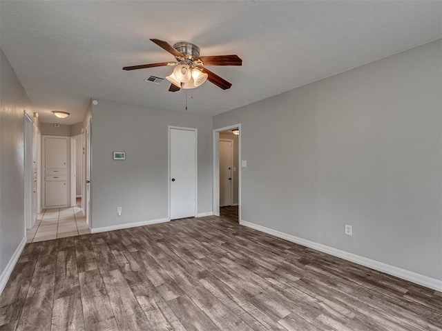 2805 SW 60th St, Oklahoma City, OK 73159 - unfurnished room featuring wood finished floors and ceiling fan