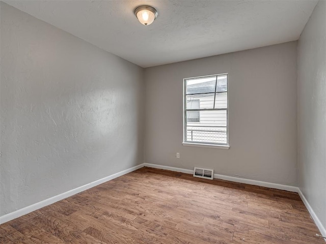 2805 SW 60th St, Oklahoma City, OK 73159 - unfurnished room featuring wood finished floors and baseboards