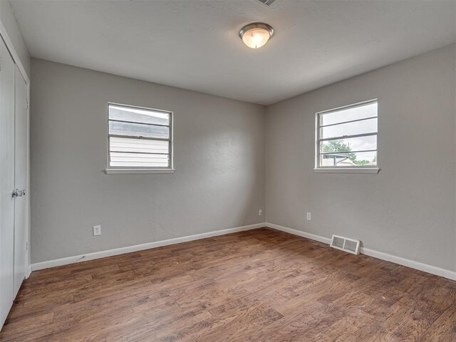 2805 SW 60th St, Oklahoma City, OK 73159 - empty room featuring wood finished floors and baseboards