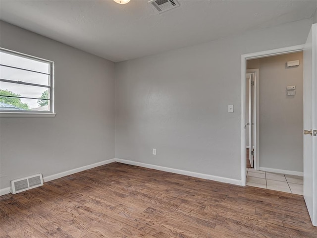 2805 SW 60th St, Oklahoma City, OK 73159 - unfurnished room with light wood-style flooring and baseboards