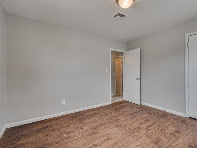 2805 SW 60th St, Oklahoma City, OK 73159 - spare room featuring wood finished floors and baseboards