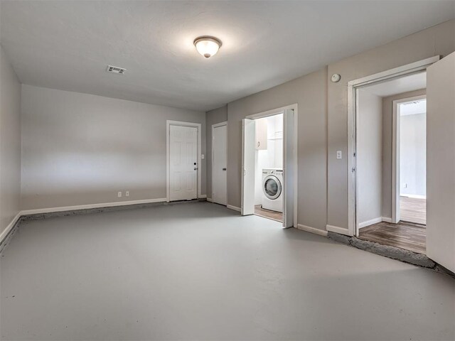 2805 SW 60th St, Oklahoma City, OK 73159 - unfurnished room featuring washer / dryer and finished concrete flooring