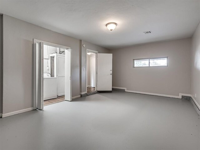 2805 SW 60th St, Oklahoma City, OK 73159 - empty room featuring washer / clothes dryer and finished concrete flooring