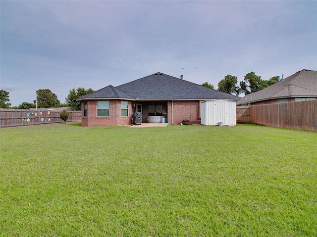1201 W Churchill Way, Mustang, OK 73064 - rear view of house featuring a fenced backyard, brick siding, a shed, and a shingled roof