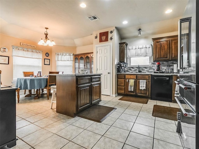 1201 W Churchill Way, Mustang, OK 73064 - kitchen featuring dishwasher, a chandelier, light tile patterned flooring, backsplash, and recessed lighting