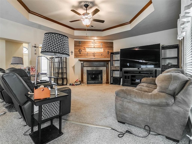 1201 W Churchill Way, Mustang, OK 73064 - carpeted living area with a raised ceiling, ornamental molding, ceiling fan, and a fireplace