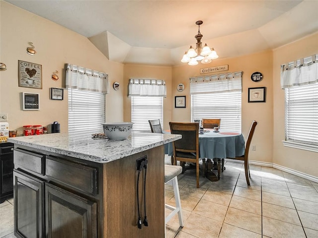 1201 W Churchill Way, Mustang, OK 73064 - kitchen featuring light tile patterned flooring, healthy amount of natural light, and a chandelier