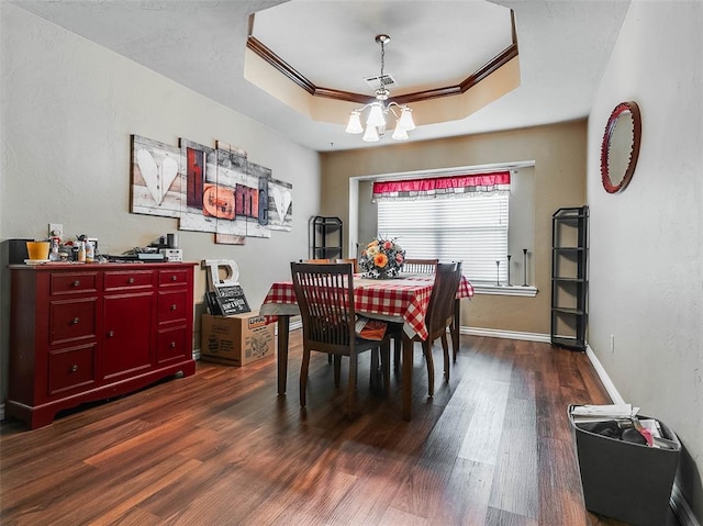 1201 W Churchill Way, Mustang, OK 73064 - dining space with ornamental molding, dark wood finished floors, a raised ceiling, and a chandelier