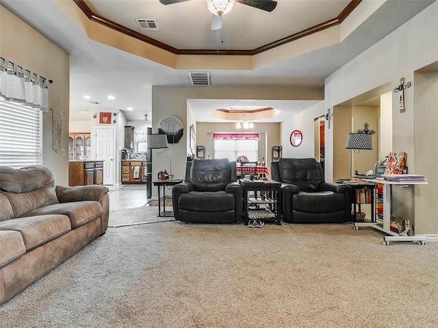1201 W Churchill Way, Mustang, OK 73064 - carpeted living area with a raised ceiling, ornamental molding, a ceiling fan, and recessed lighting