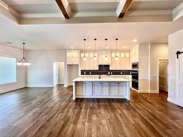 16405 Brookefield Dr, Edmond, OK 73013 - kitchen featuring white cabinetry, dark wood-style flooring, tasteful backsplash, a chandelier, and glass insert cabinets
