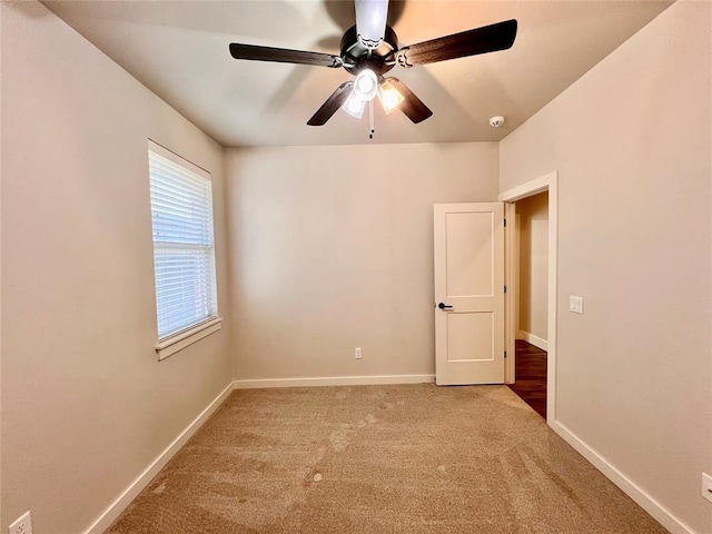 16405 Brookefield Dr, Edmond, OK 73013 - empty room featuring carpet floors, a ceiling fan, and a smoke detector