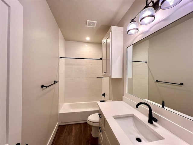 16405 Brookefield Dr, Edmond, OK 73013 - full bath featuring vanity, wood finished floors,  shower combination, and recessed lighting