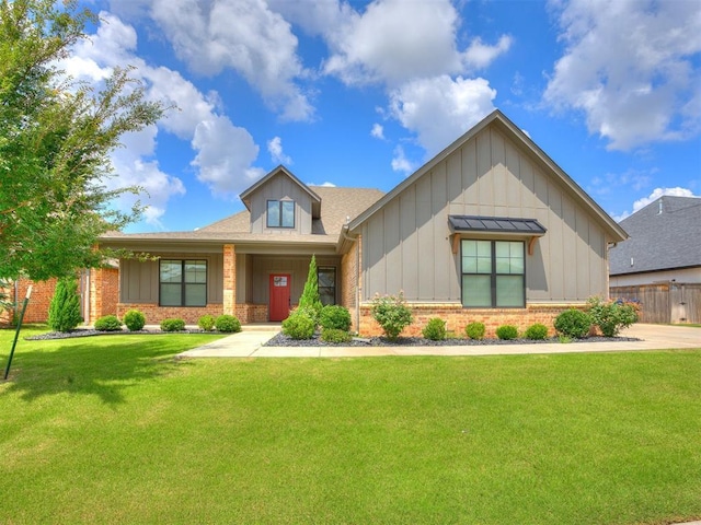 16405 Brookefield Dr, Edmond, OK 73013 - view of front facade featuring board and batten siding, a front lawn, brick siding, and roof with shingles