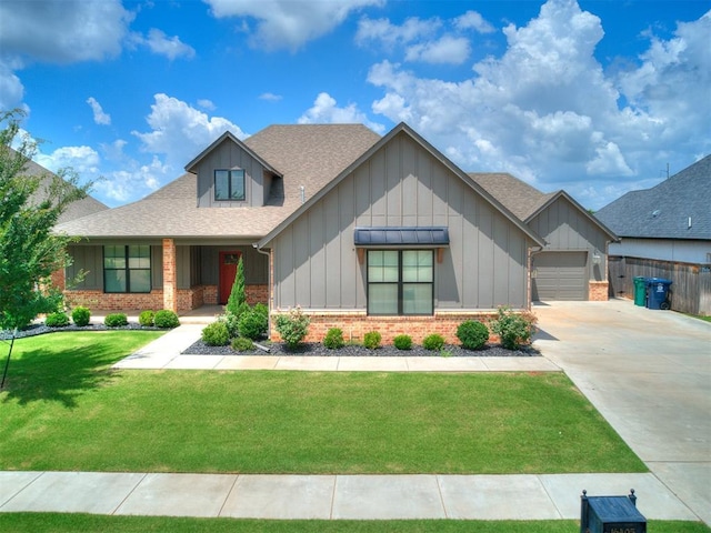 16405 Brookefield Dr, Edmond, OK 73013 - view of front facade featuring brick siding, board and batten siding, driveway, a shingled roof, and an attached garage
