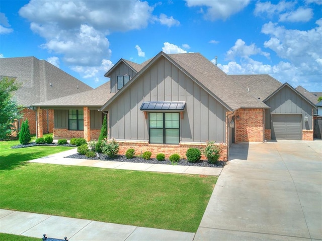 16405 Brookefield Dr, Edmond, OK 73013 - view of front of house with board and batten siding, brick siding, and driveway