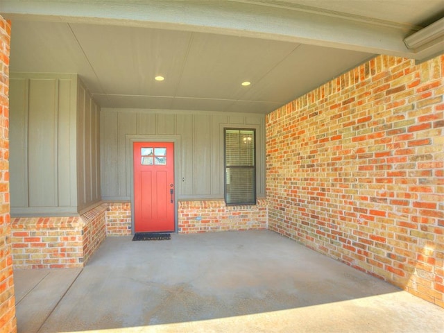 16405 Brookefield Dr, Edmond, OK 73013 - entrance to property with brick siding and board and batten siding