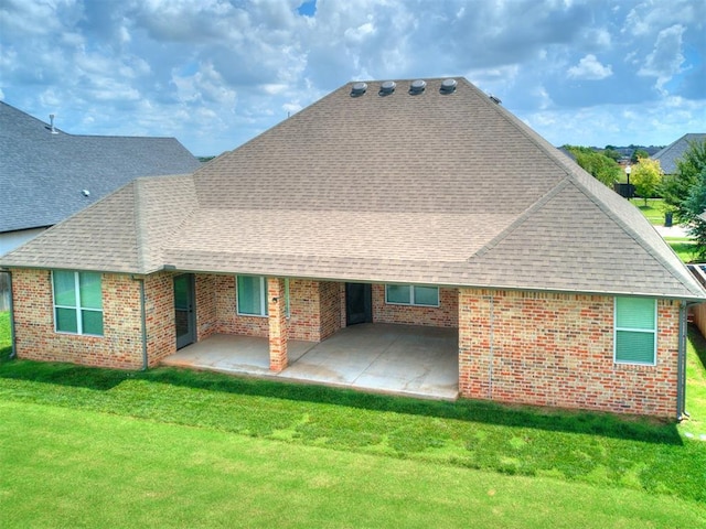 16405 Brookefield Dr, Edmond, OK 73013 - back of property with roof with shingles, a patio area, and a yard