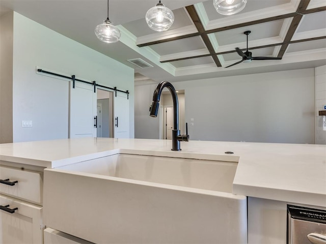 16405 Brookefield Dr, Edmond, OK 73013 - kitchen view of coffered ceiling, light countertops, beamed ceiling, ceiling fan, and a barn door