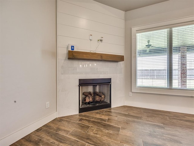 16405 Brookefield Dr, Edmond, OK 73013 - unfurnished living room featuring wood finished floors and a fireplace