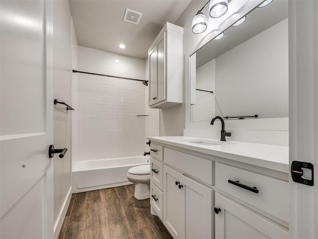 16405 Brookefield Dr, Edmond, OK 73013 - full bathroom featuring vanity, wood finished floors, shower / bathtub combination, and recessed lighting