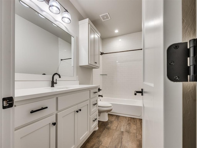 16405 Brookefield Dr, Edmond, OK 73013 - bathroom with wood finished floors, vanity, shower / washtub combination, and recessed lighting