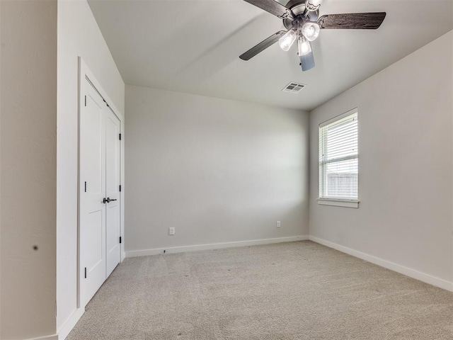 16405 Brookefield Dr, Edmond, OK 73013 - unfurnished bedroom with light colored carpet and ceiling fan