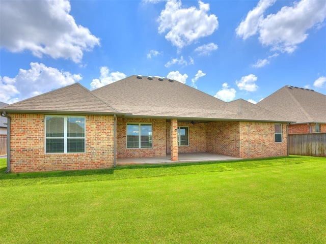 16405 Brookefield Dr, Edmond, OK 73013 - back of property featuring brick siding, a patio area, ceiling fan, and roof with shingles