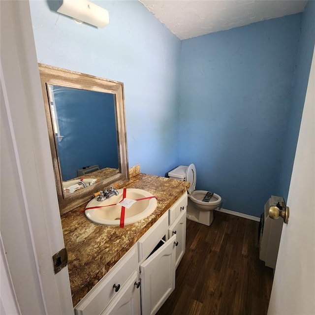 2413 7th St, Prague, OK 74864 - bathroom featuring vanity and wood finished floors