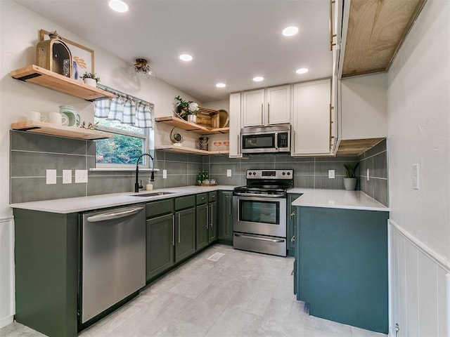 1408 Chimney Hill Rd, Yukon, OK 73099 - kitchen featuring green cabinets, stainless steel appliances, open shelves, light countertops, and tasteful backsplash