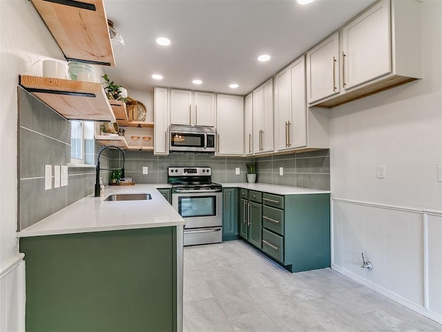 1408 Chimney Hill Rd, Yukon, OK 73099 - kitchen with appliances with stainless steel finishes, open shelves, green cabinets, light countertops, and decorative backsplash