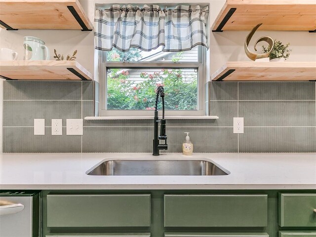 1408 Chimney Hill Rd, Yukon, OK 73099 - kitchen with green cabinetry, light countertops, decorative backsplash, and stainless steel dishwasher