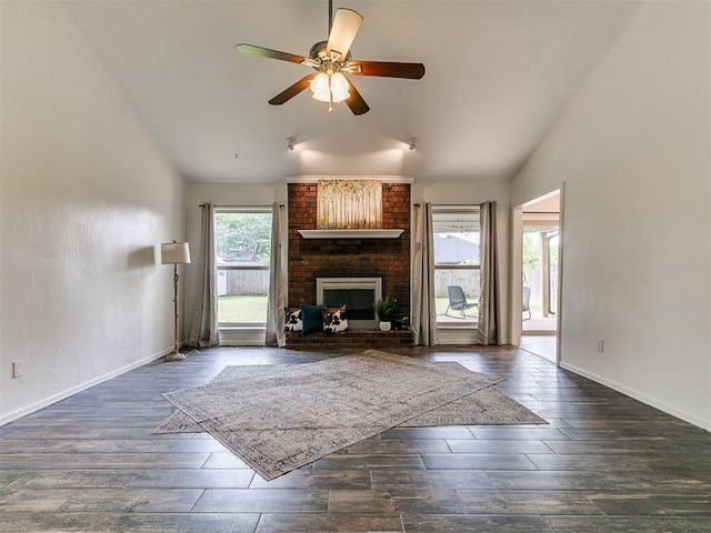 1408 Chimney Hill Rd, Yukon, OK 73099 - unfurnished living room with vaulted ceiling, wood finished floors, a fireplace, and ceiling fan
