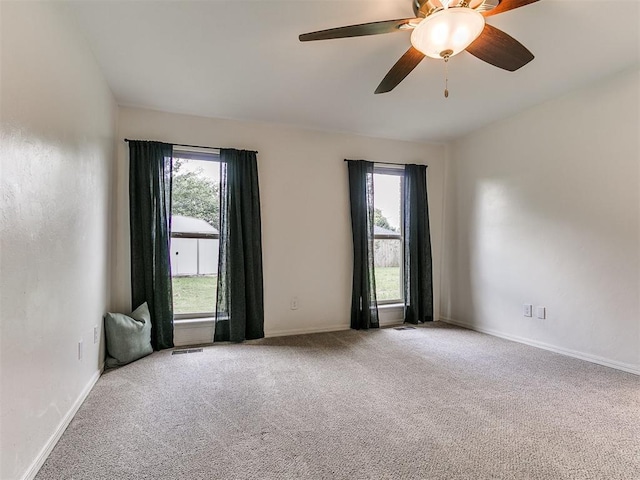 1408 Chimney Hill Rd, Yukon, OK 73099 - spare room with carpet, plenty of natural light, and a ceiling fan