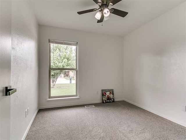 1408 Chimney Hill Rd, Yukon, OK 73099 - carpeted empty room featuring baseboards and a ceiling fan